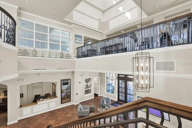a view of a living room with furniture and windows