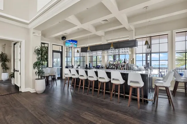 a view of a dining room with furniture wooden floor and chandelier