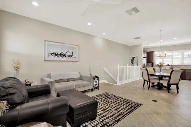 a living room with furniture or view of the kitchen