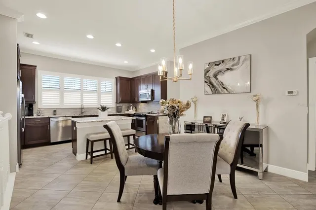 a dining room with furniture and window