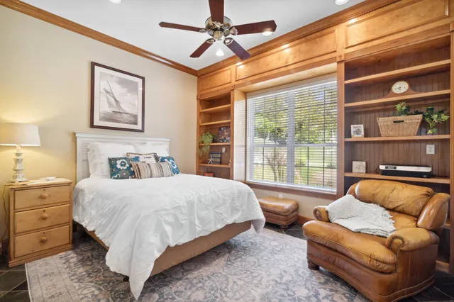 a view of a dining room with furniture large windows and wooden floor