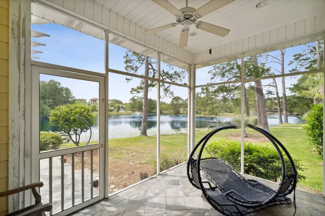 a view of a lake with houses in the background