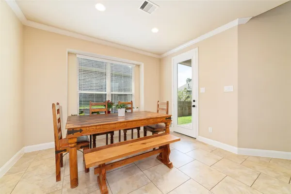 a view of a room with furniture and window