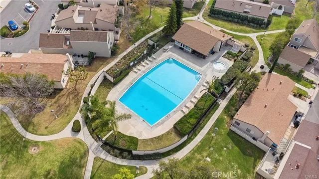 an aerial view of a house with a swimming pool