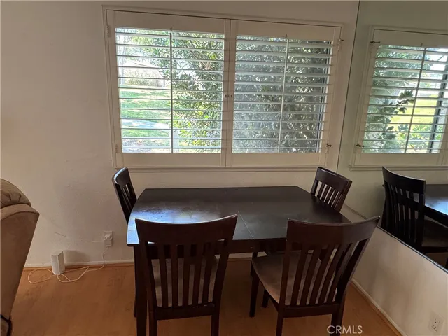 a view of a a dining room with furniture window and outside view