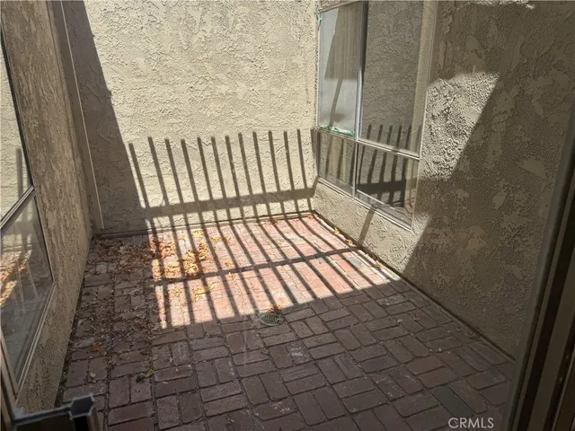 a view of a balcony with wooden floor