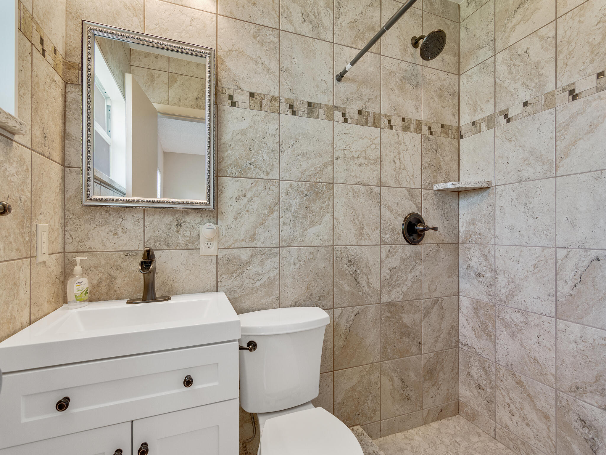 Undisclosed Address Vero Beach, FL 32960 - Photo 17 of 29 a bathroom with a toilet sink and shower