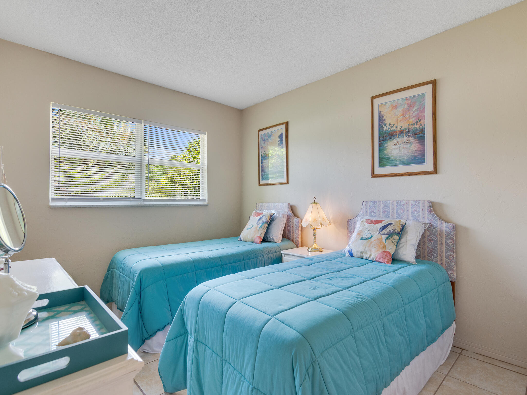 Undisclosed Address Vero Beach, FL 32960 - Photo 18 of 29 a bedroom with two beds and a window