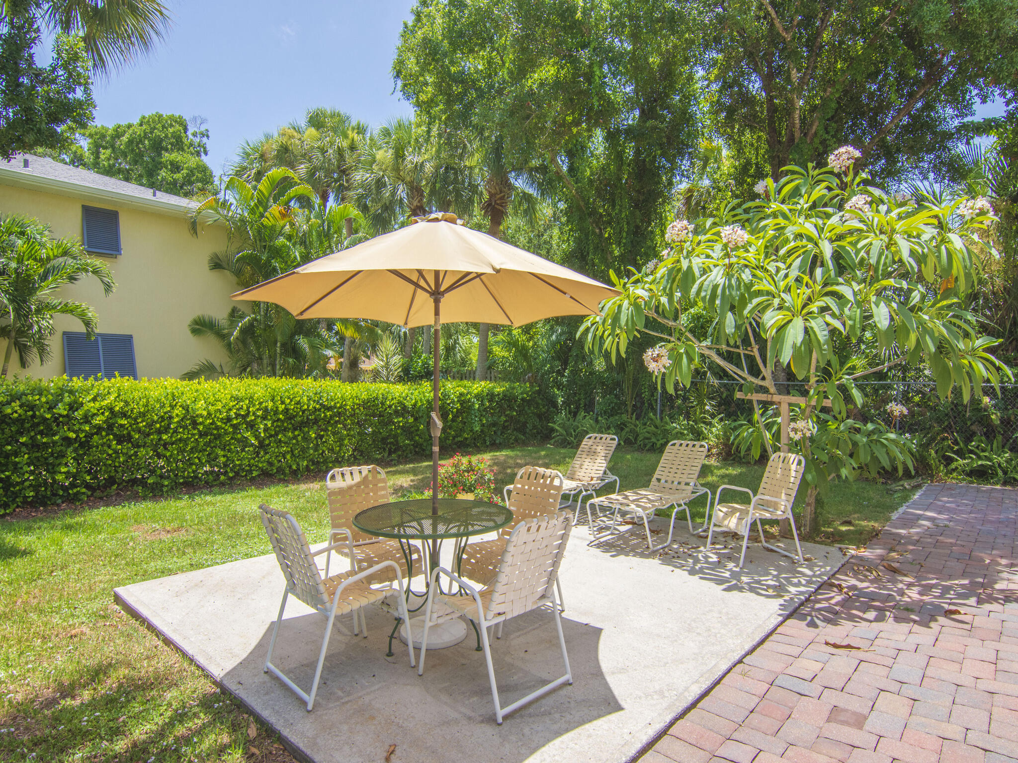 Undisclosed Address Vero Beach, FL 32960 - Photo 27 of 29 a view of backyard with seating space and trees