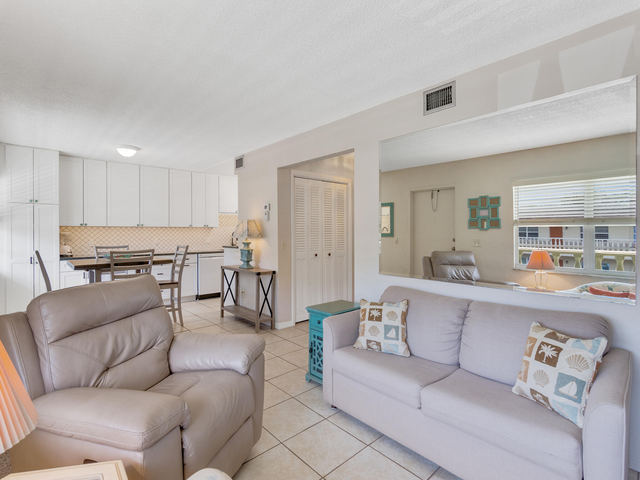 Undisclosed Address Vero Beach, FL 32960 - Photo 8 of 29 a living room with furniture and kitchen view
