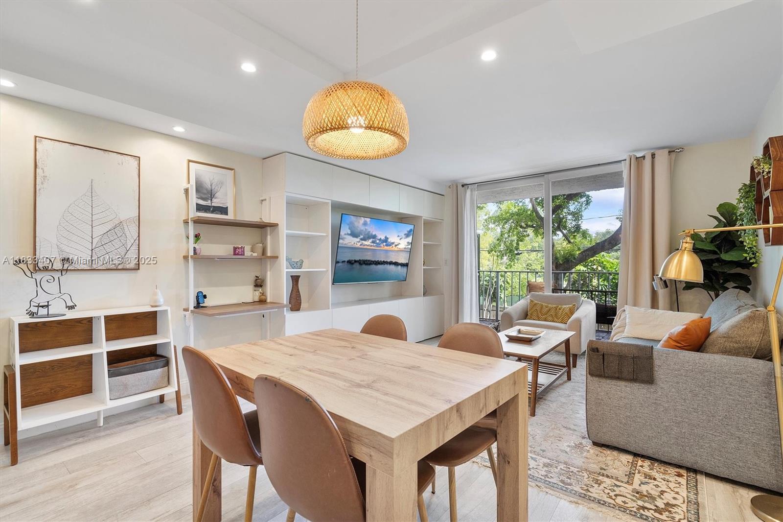 650 Northeast 64th Street, Unit G210 Miami, FL 33138 - Photo 12 of 25 a view of a dining room with furniture window and wooden floor
