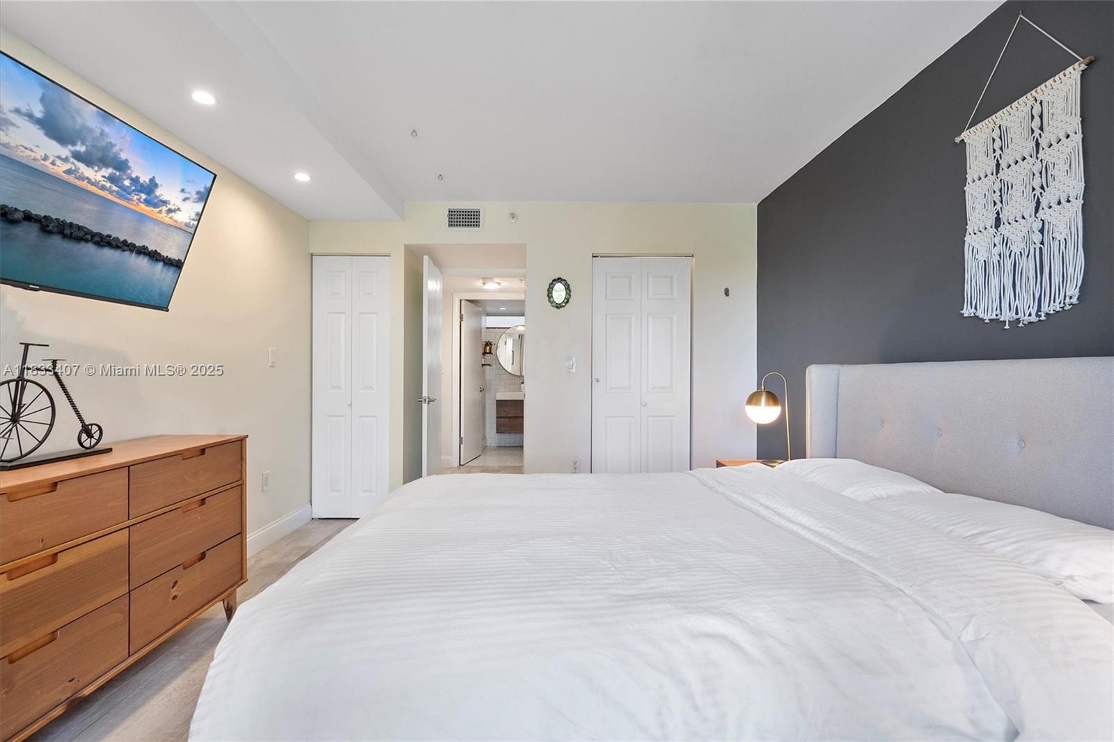 650 Northeast 64th Street, Unit G210 Miami, FL 33138 - Photo 18 of 25 a large white bed in a white room