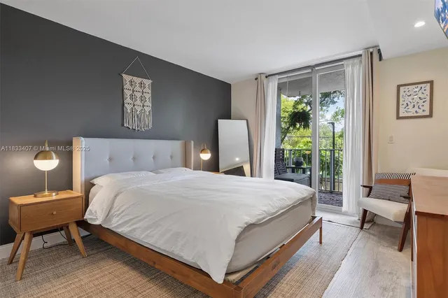 a bedroom with a bed and a table