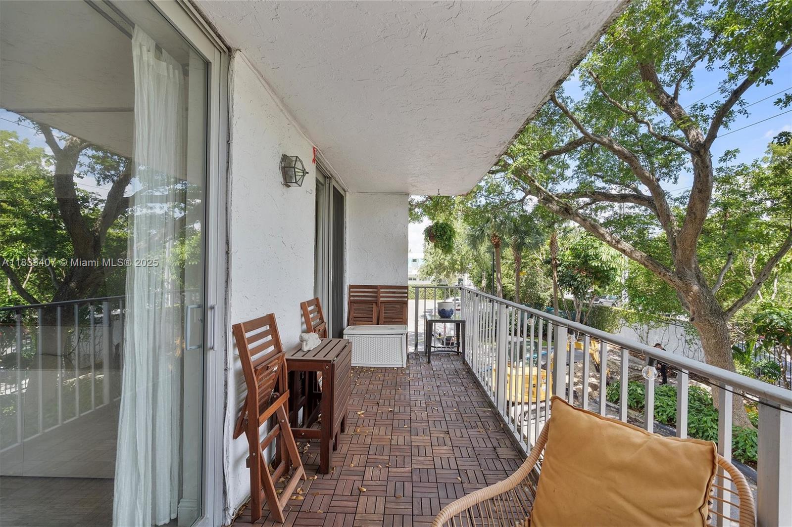 650 Northeast 64th Street, Unit G210 Miami, FL 33138 - Photo 8 of 25 a view of balcony with furniture
