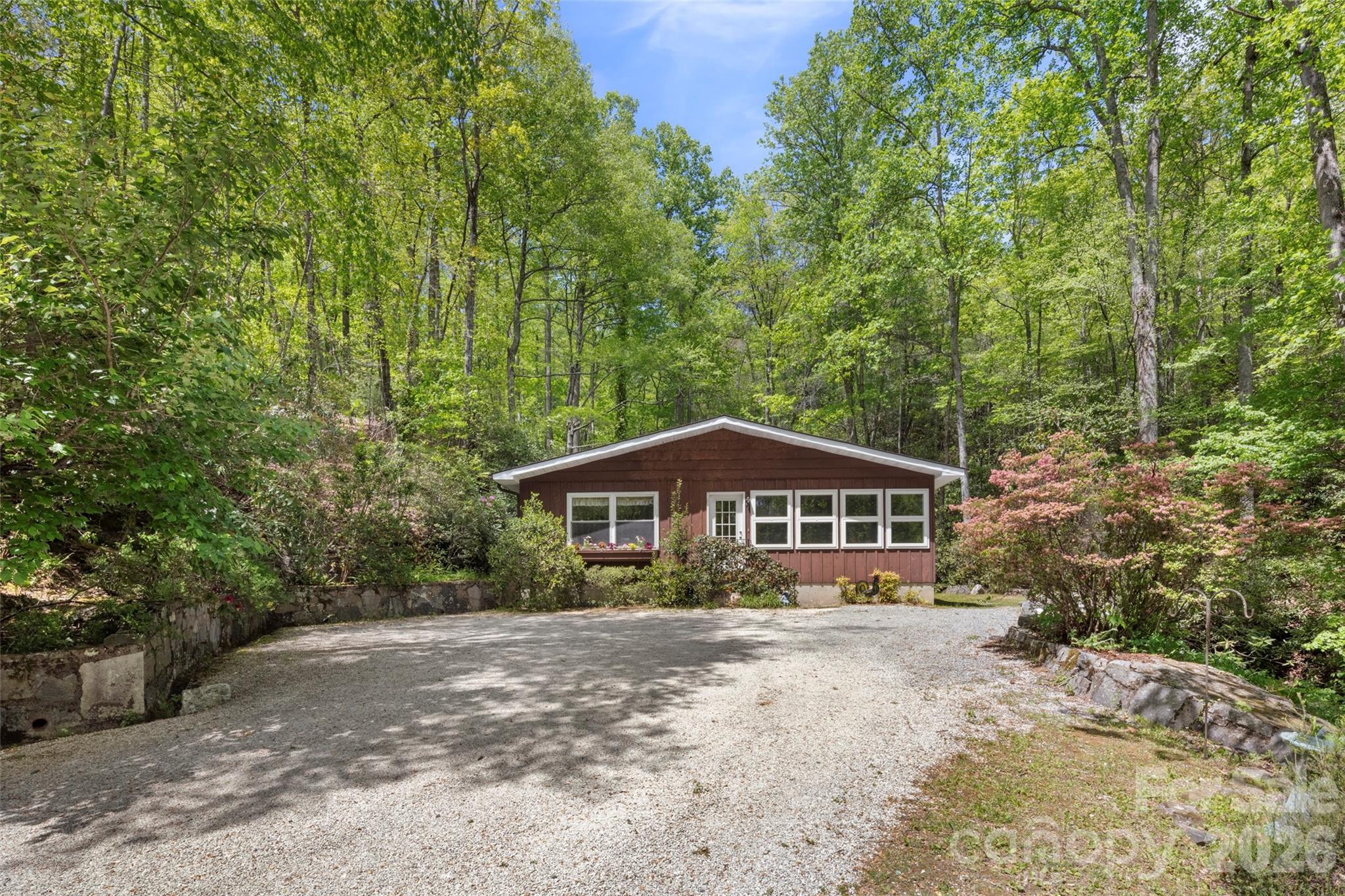 812 Crab Creek Road Hendersonville, NC 28739 - Photo 1 of 33 a view of a house with a yard