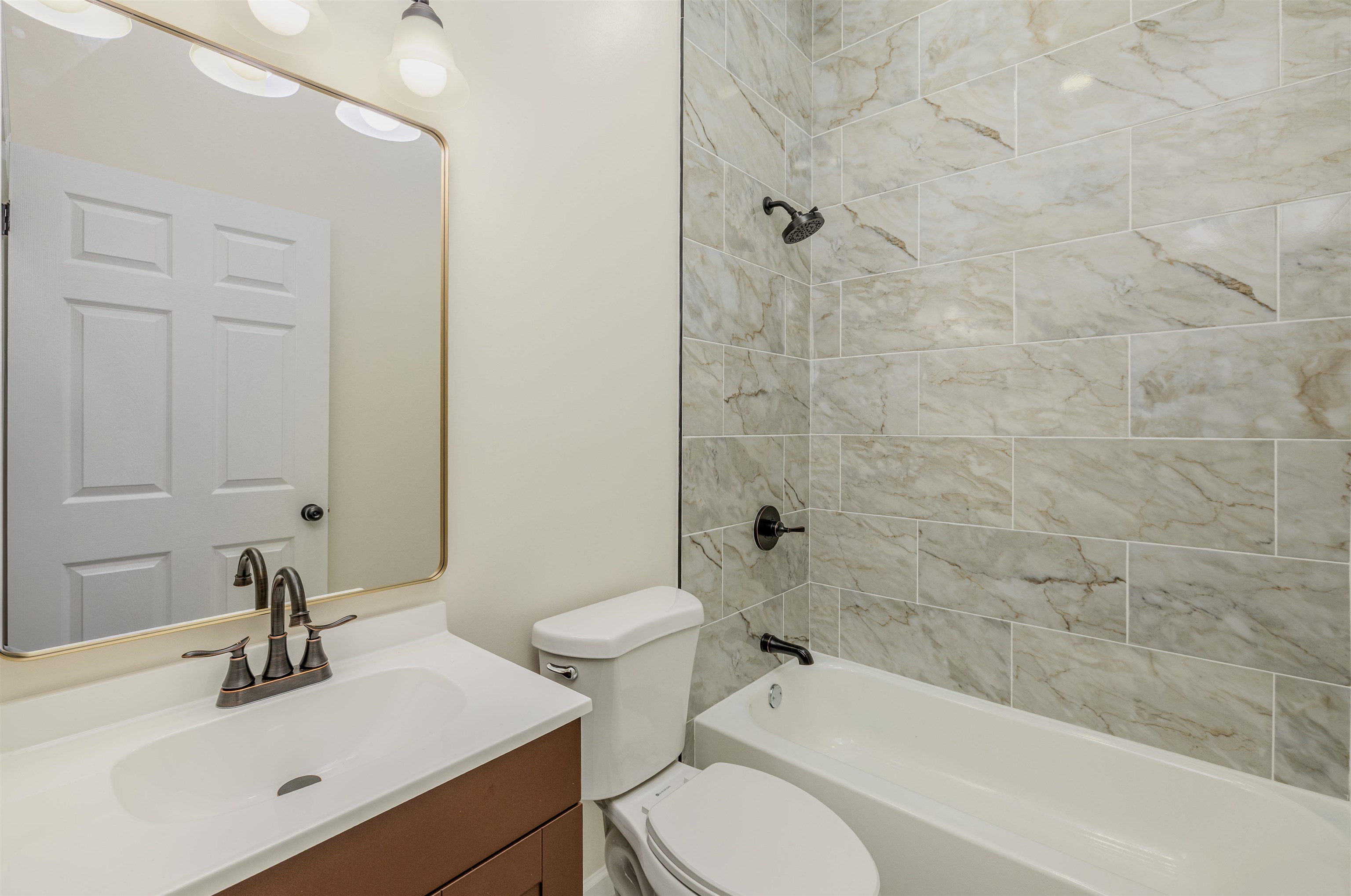 1069 Shaw Place Memphis, TN 38126 - Photo 13 of 23 a bathroom with a sink toilet and shower