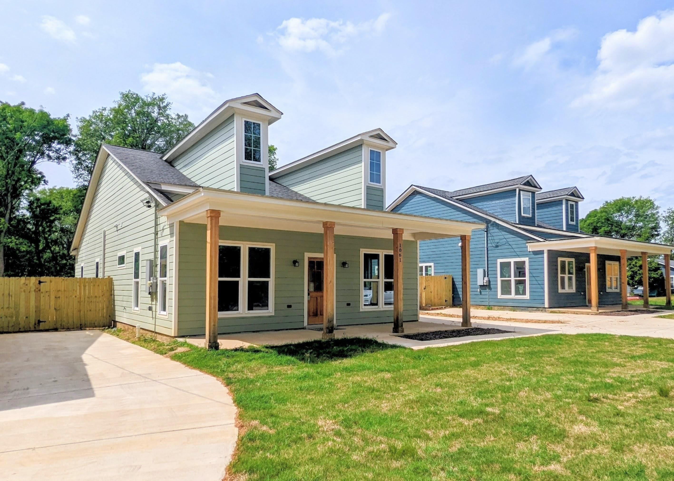 1069 Shaw Place Memphis, TN 38126 - Photo 3 of 23 View of front facade with a porch, a gate, and roof with shingles