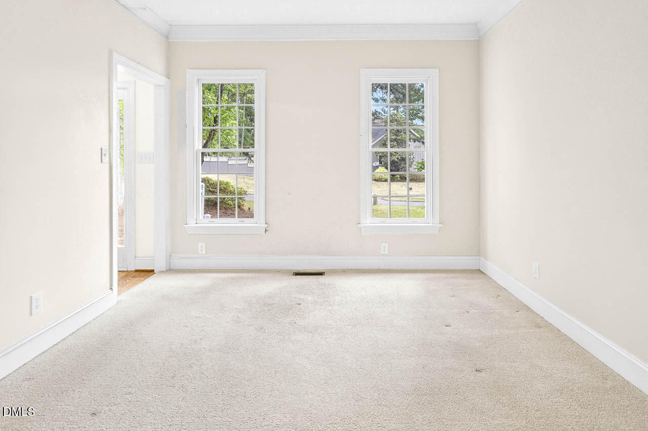 2209 Lodestar Drive Raleigh, NC 27615 - Photo 23 of 50 an empty room with windows