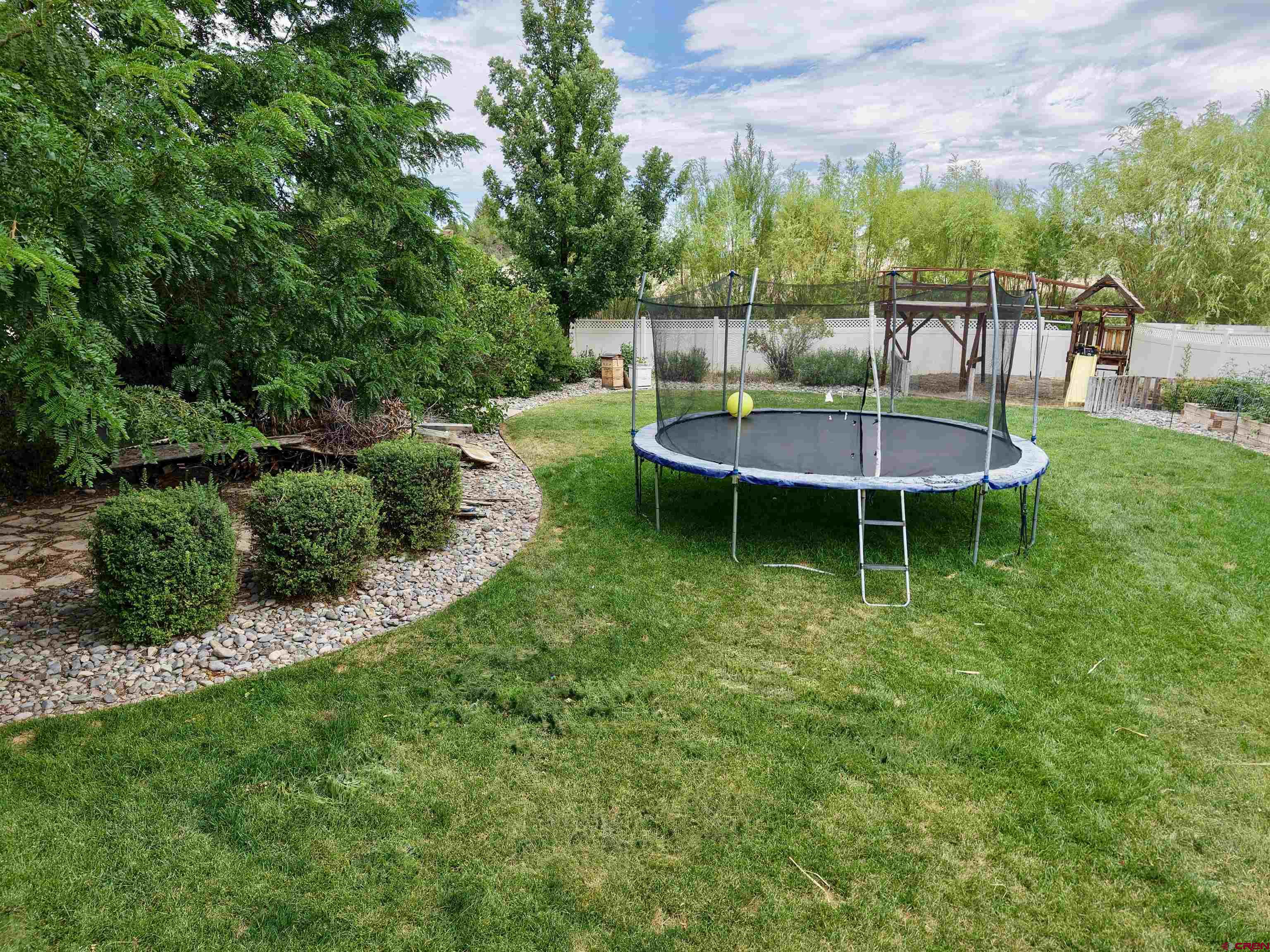 2941 Lost Creek Road North Montrose, CO 81401 - Photo 12 of 45 a view of a swimming pool with a table and chairs