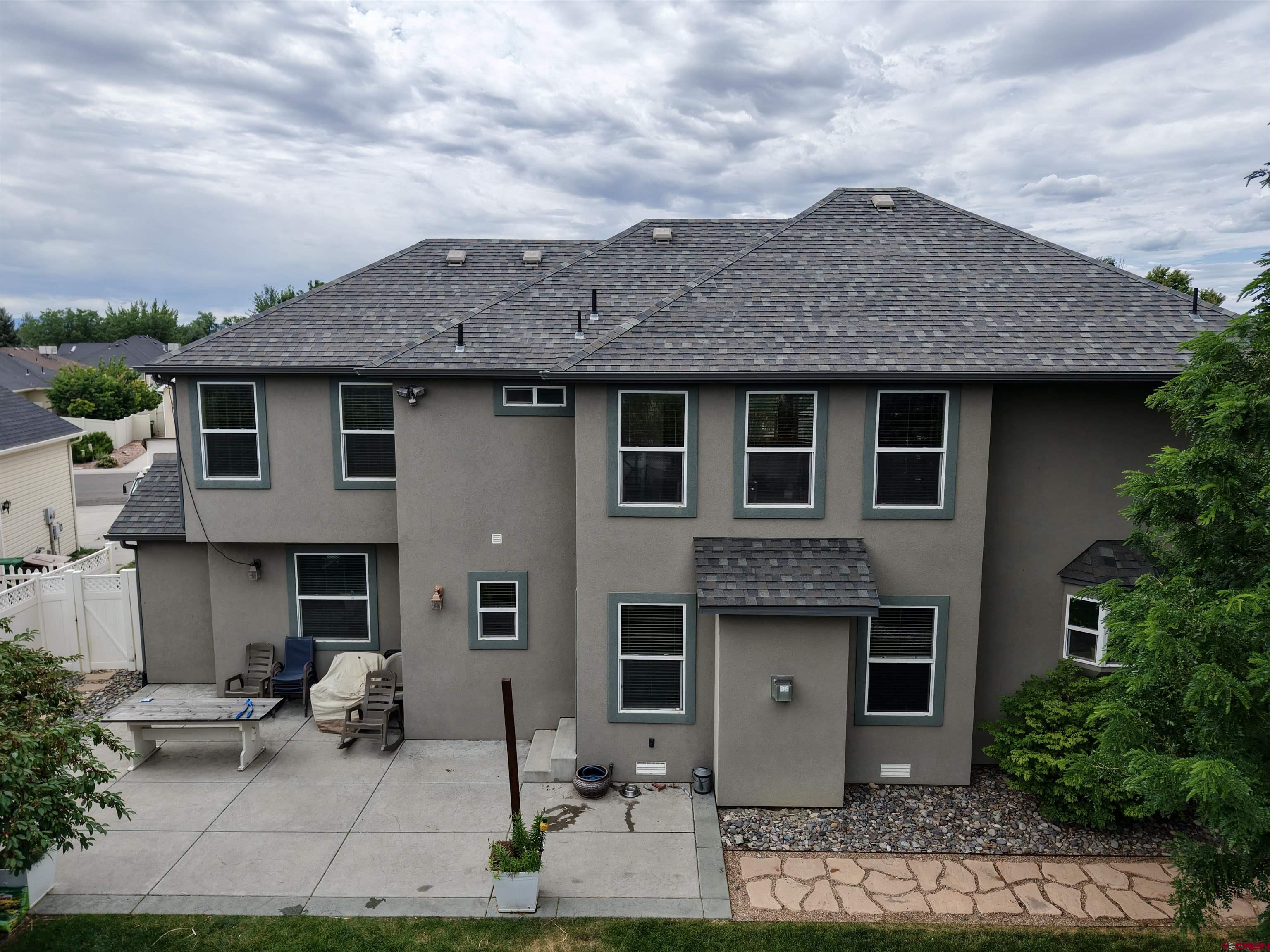 2941 Lost Creek Road North Montrose, CO 81401 - Photo 13 of 45 a front view of a house with garden
