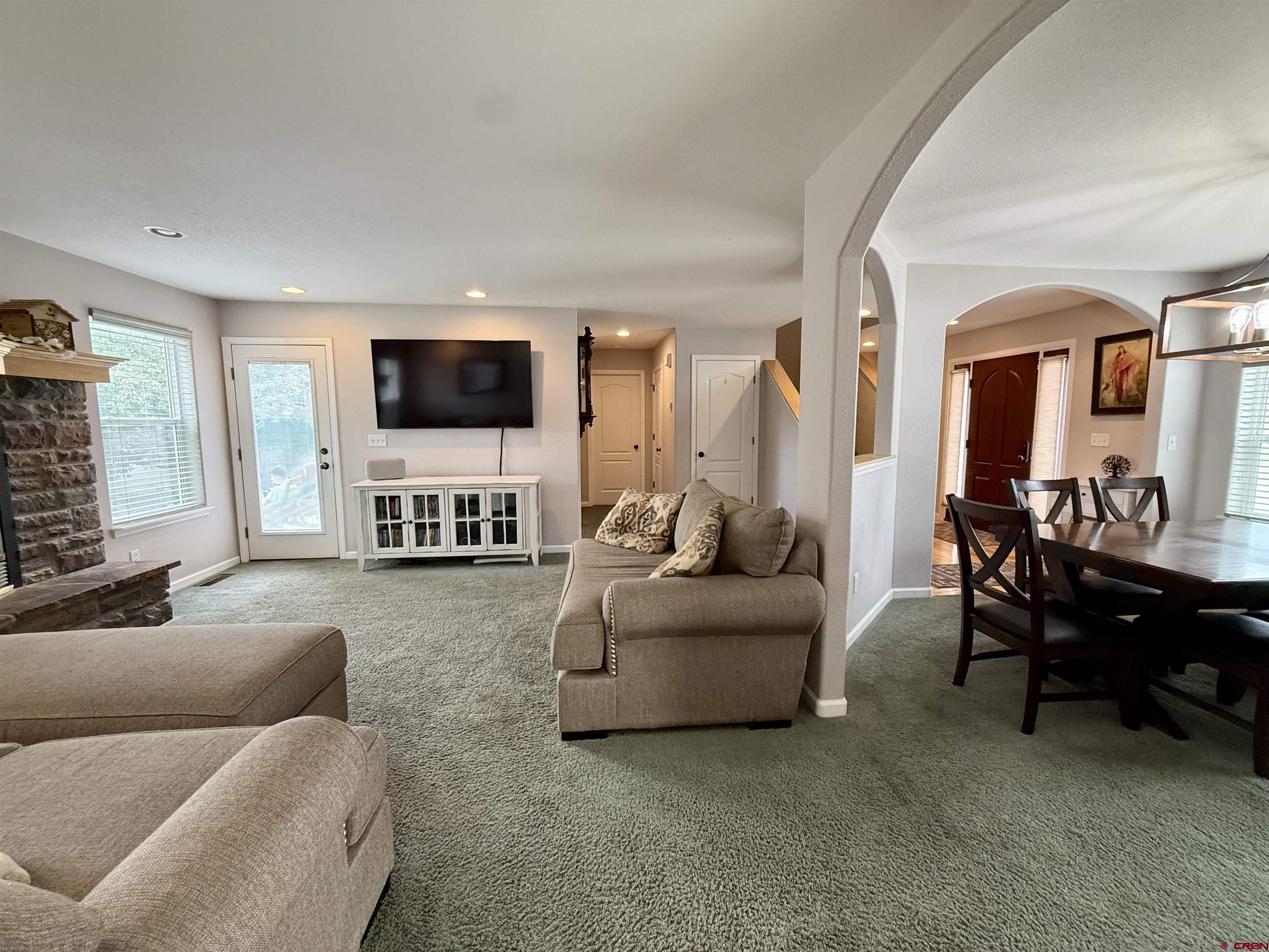 2941 Lost Creek Road North Montrose, CO 81401 - Photo 13 of 45 a living room with furniture and a flat screen tv