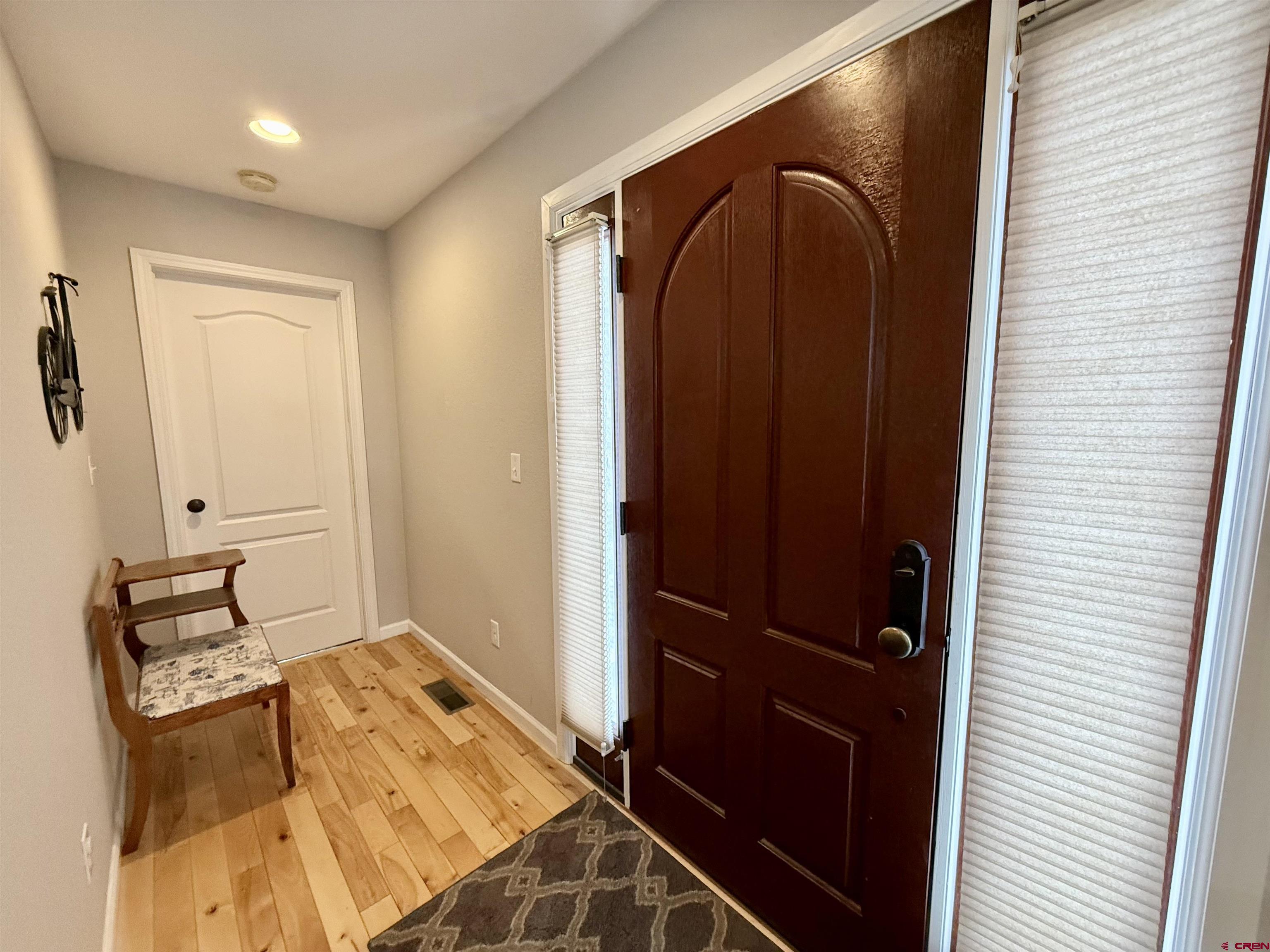 2941 Lost Creek Road North Montrose, CO 81401 - Photo 14 of 45 a bedroom with a bed and a mirror