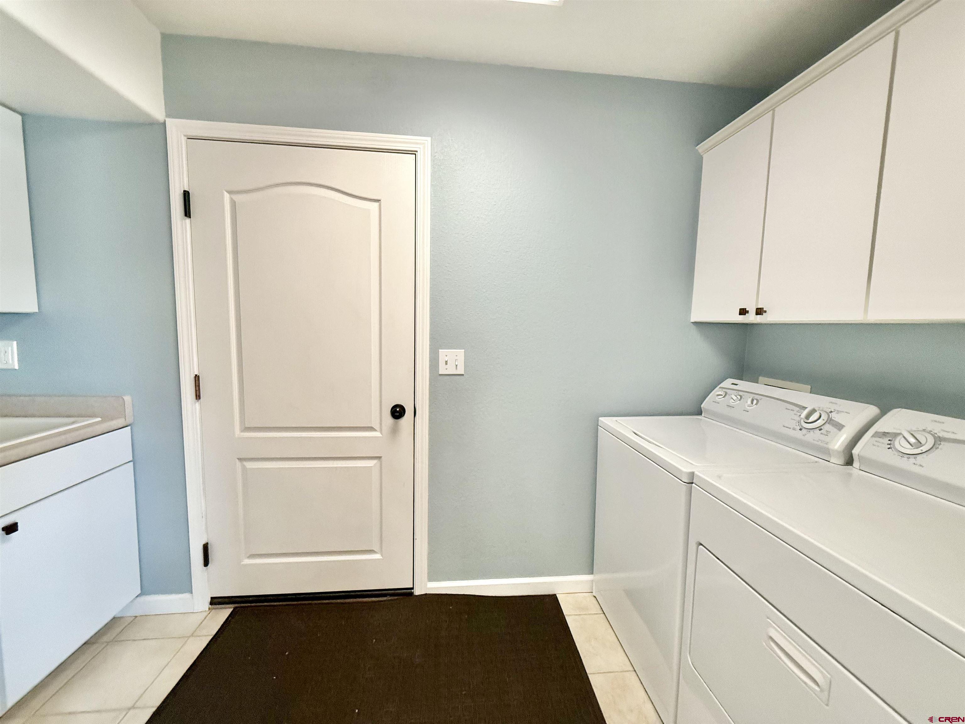 2941 Lost Creek Road North Montrose, CO 81401 - Photo 20 of 45 a utility room with dryer and washer