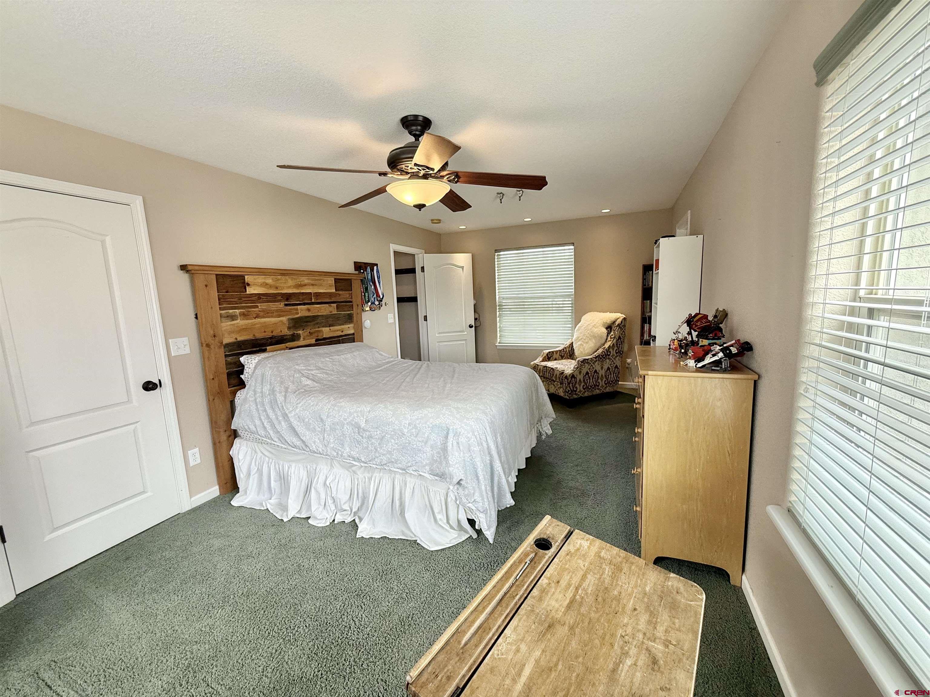 2941 Lost Creek Road North Montrose, CO 81401 - Photo 25 of 45 a bedroom with bed and window