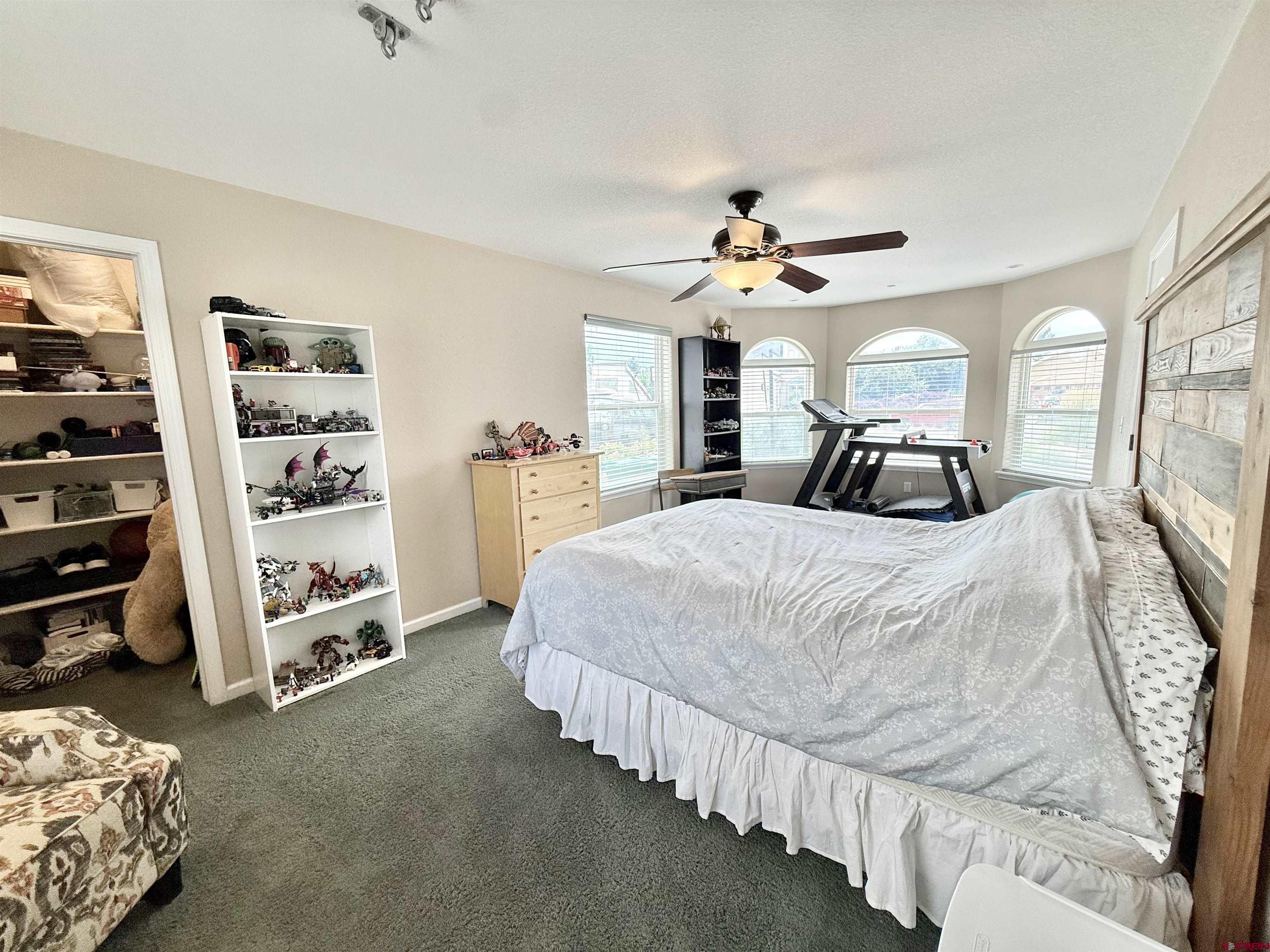 2941 Lost Creek Road North Montrose, CO 81401 - Photo 26 of 45 a bedroom with bed and window