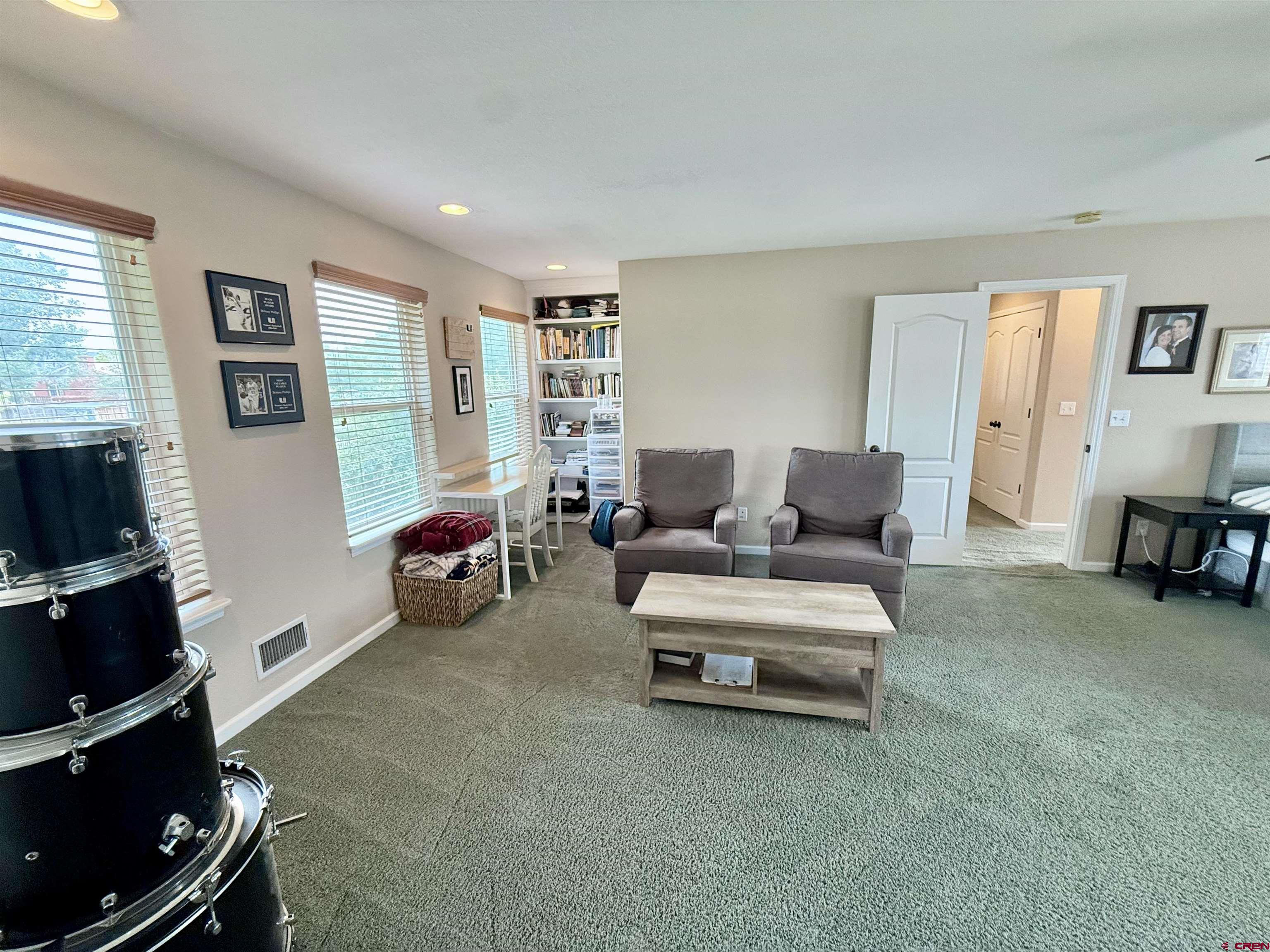 2941 Lost Creek Road North Montrose, CO 81401 - Photo 36 of 45 a living room with furniture and a flat screen tv