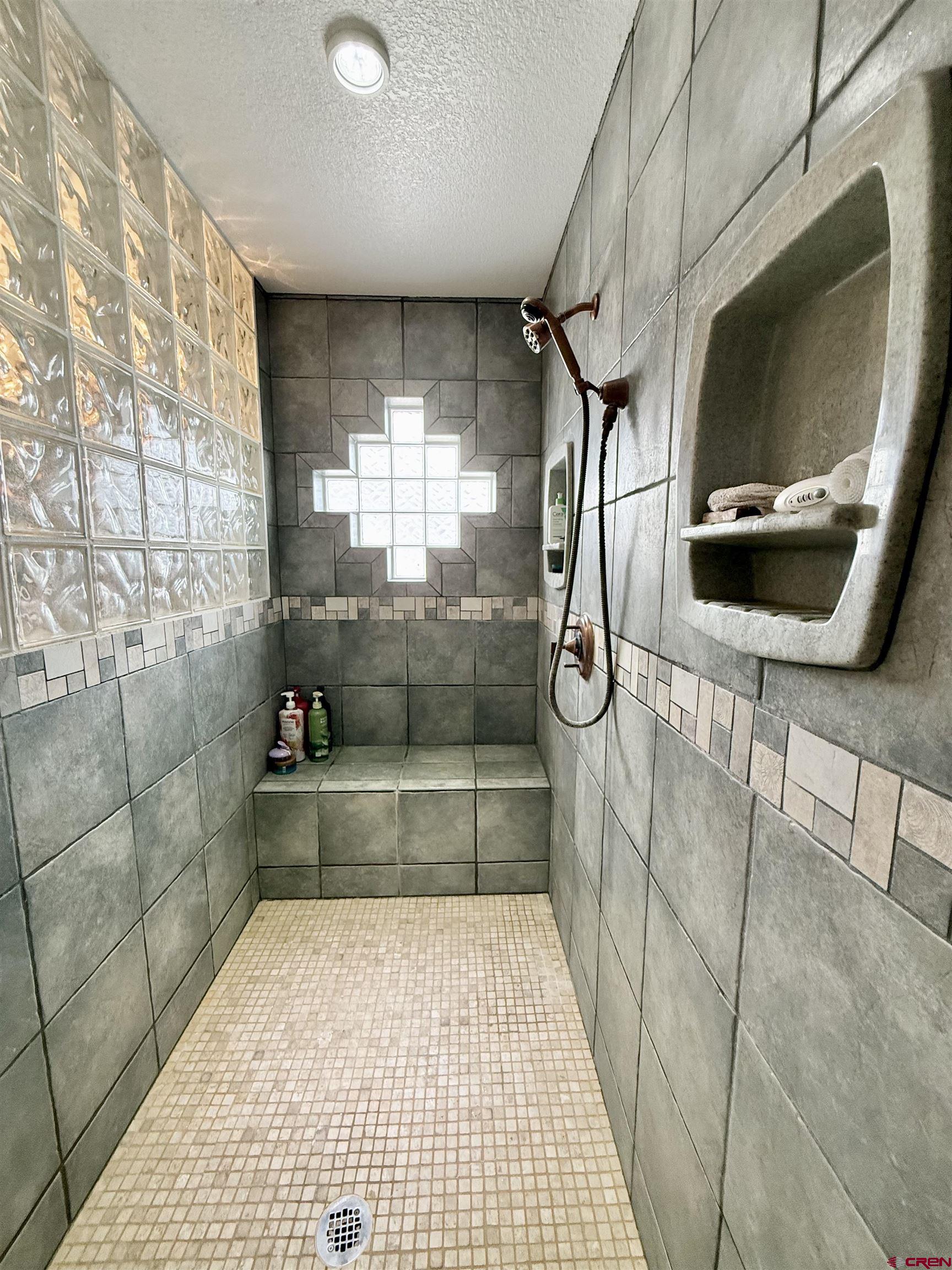 2941 Lost Creek Road North Montrose, CO 81401 - Photo 39 of 45 a bathroom with a shower