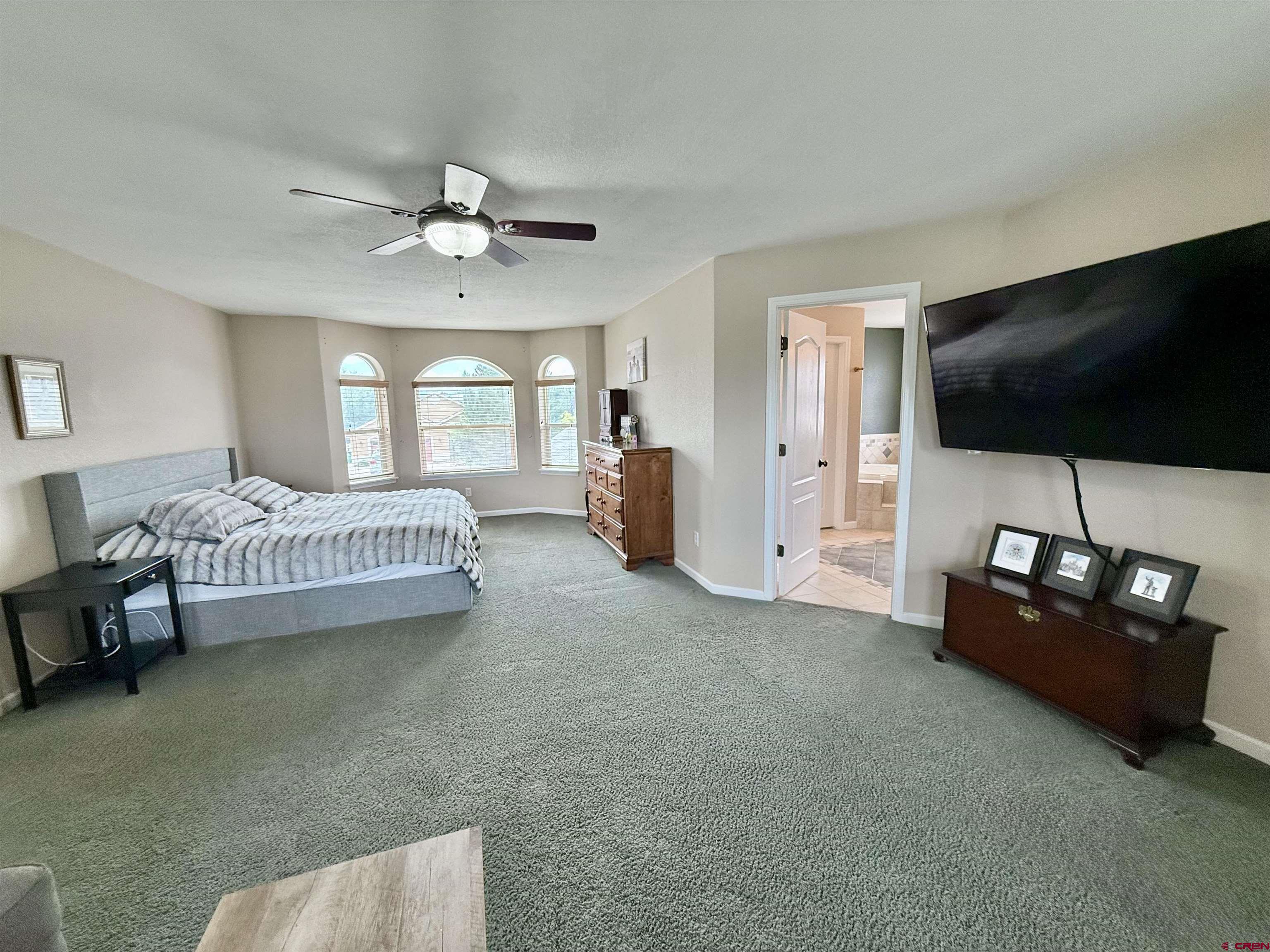 2941 Lost Creek Road North Montrose, CO 81401 - Photo 42 of 45 a living room with furniture and a flat screen tv