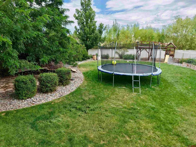 a view of a swimming pool with a table and chairs