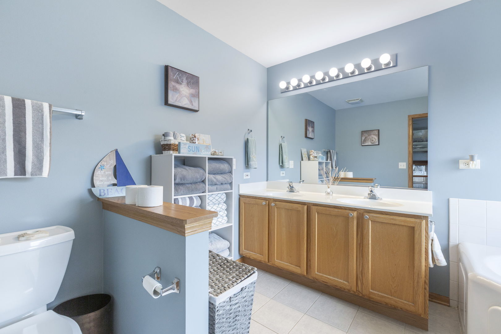 105 Inverness Court Round Lake, IL 60073 - Photo 18 of 31 a spacious bathroom with a toilet a sink and a mirror
