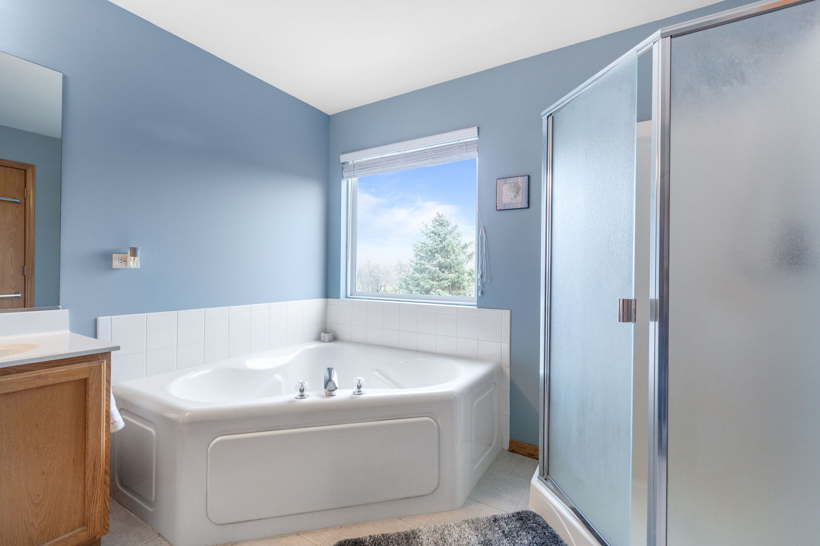 105 Inverness Court Round Lake, IL 60073 - Photo 19 of 31 a white bath tub sitting in a bathroom