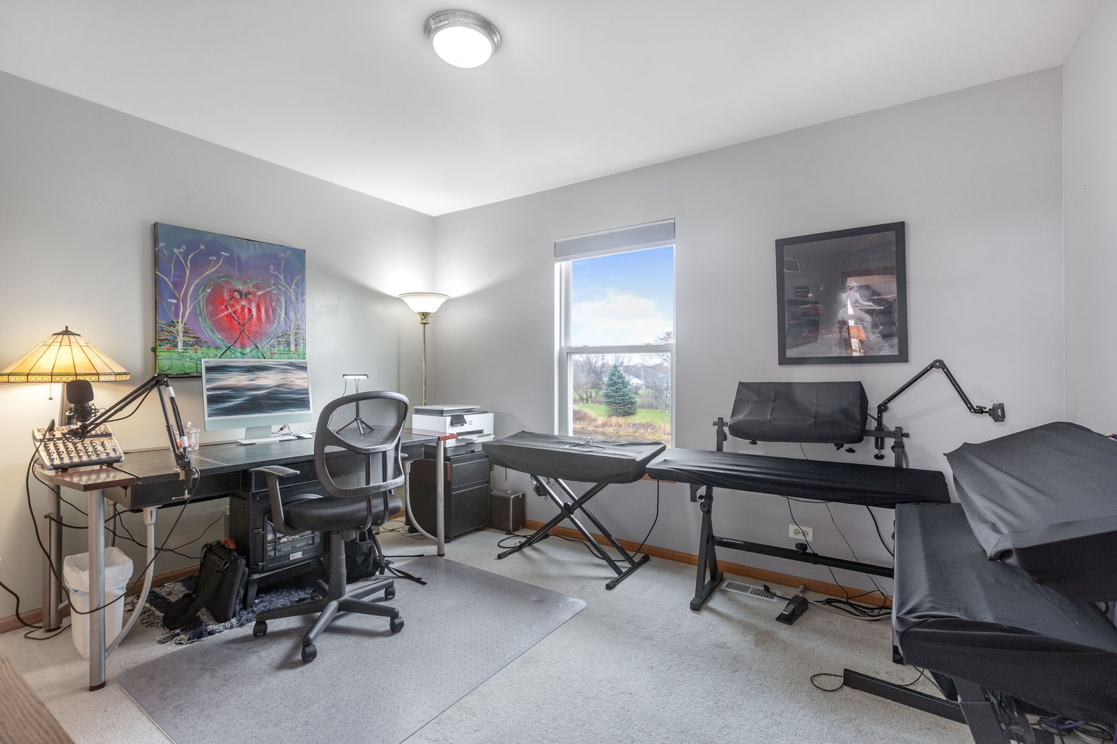 105 Inverness Court Round Lake, IL 60073 - Photo 23 of 31 a view of a workspace with furniture and a window