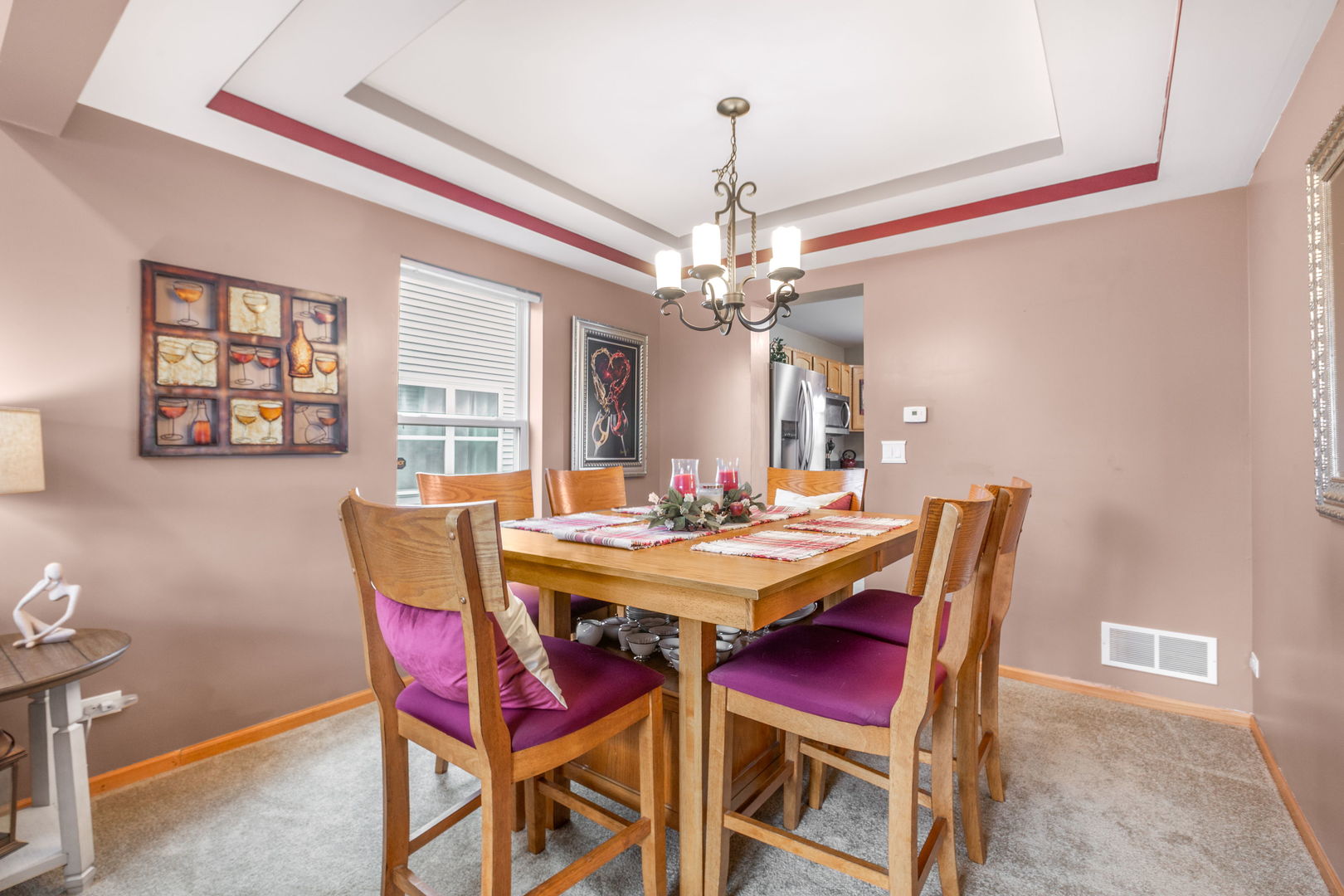 105 Inverness Court Round Lake, IL 60073 - Photo 5 of 31 a view of a dining room with furniture and chandelier