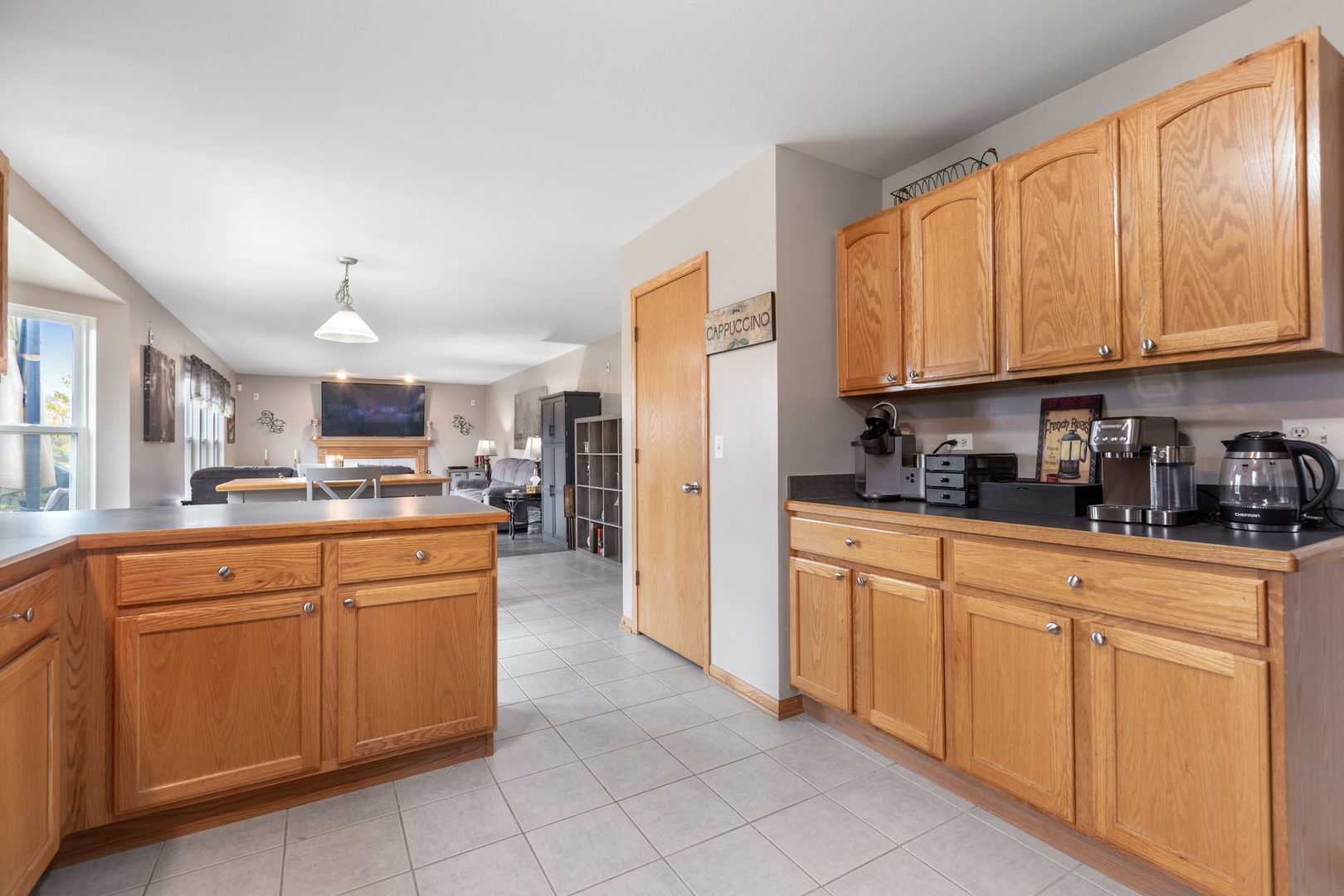 105 Inverness Court Round Lake, IL 60073 - Photo 7 of 31 a kitchen with granite countertop cabinets stainless steel appliances and a counter top space