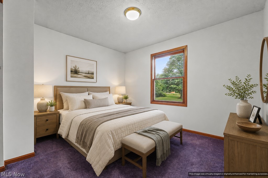 2642 Blake Road Wadsworth, OH 44281 - Photo 18 of 46 Room featuring wall-to-wall purple carpeting, white painted walls, and a single window with wood trim