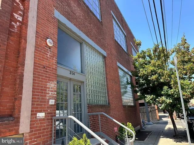 a front view of a house with outdoor space