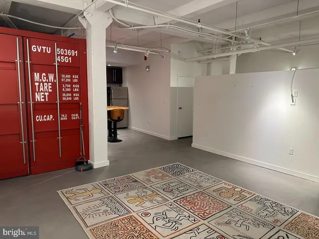 a bedroom with a bed and a mirror