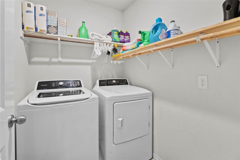 409 Wilson Way Denton, TX 76207 - Photo 23 of 33 Dedicated laundry area featuring a top-load washer and front-load dryer