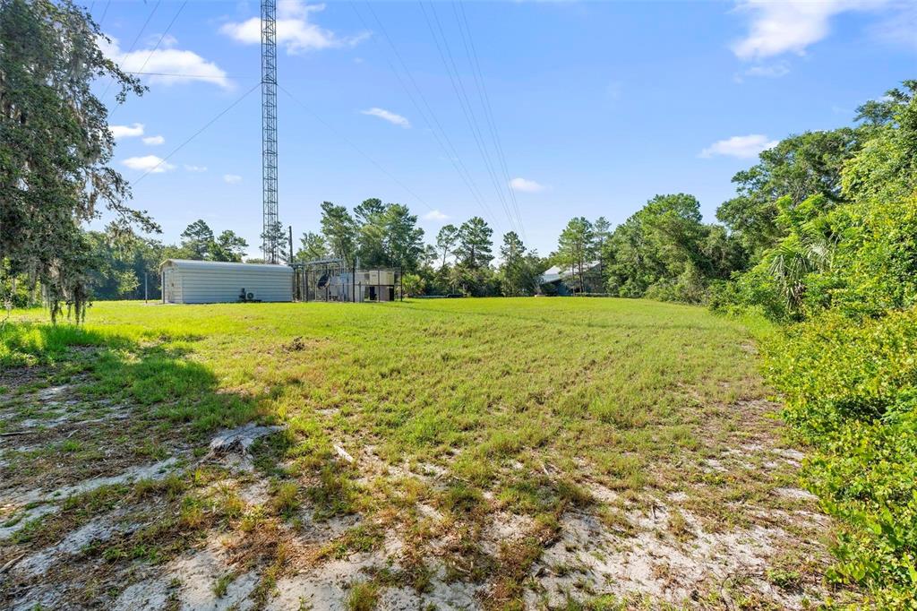1835 South Glencoe Road New Smyrna Beach, FL 32168 - Photo 18 of 29 a view of a field with an outdoor space