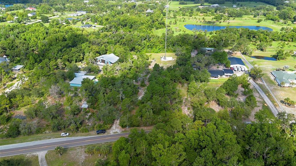 1835 South Glencoe Road New Smyrna Beach, FL 32168 - Photo 24 of 29 a view of a lake with a city