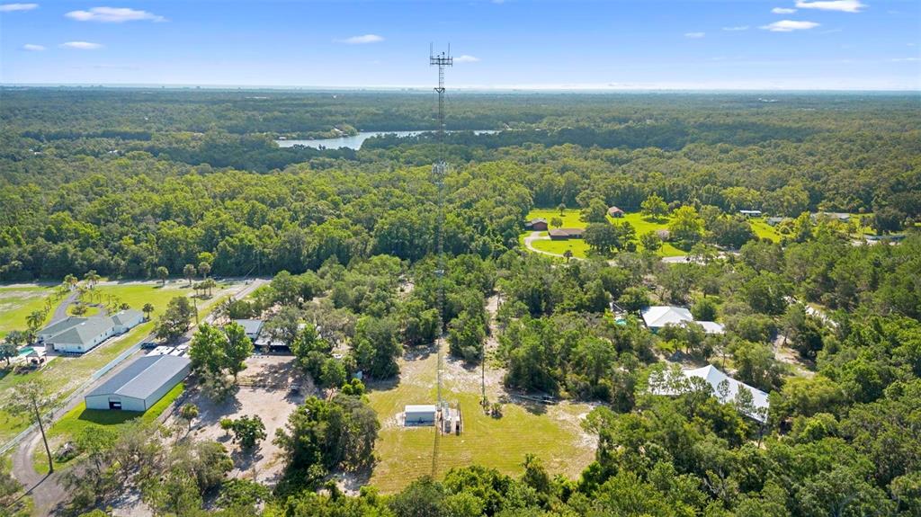 1835 South Glencoe Road New Smyrna Beach, FL 32168 - Photo 27 of 29 an aerial view of residential houses with outdoor space and trees