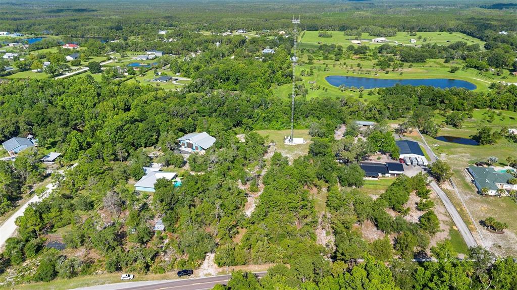 1835 South Glencoe Road New Smyrna Beach, FL 32168 - Photo 6 of 29 a view of a lake with a city