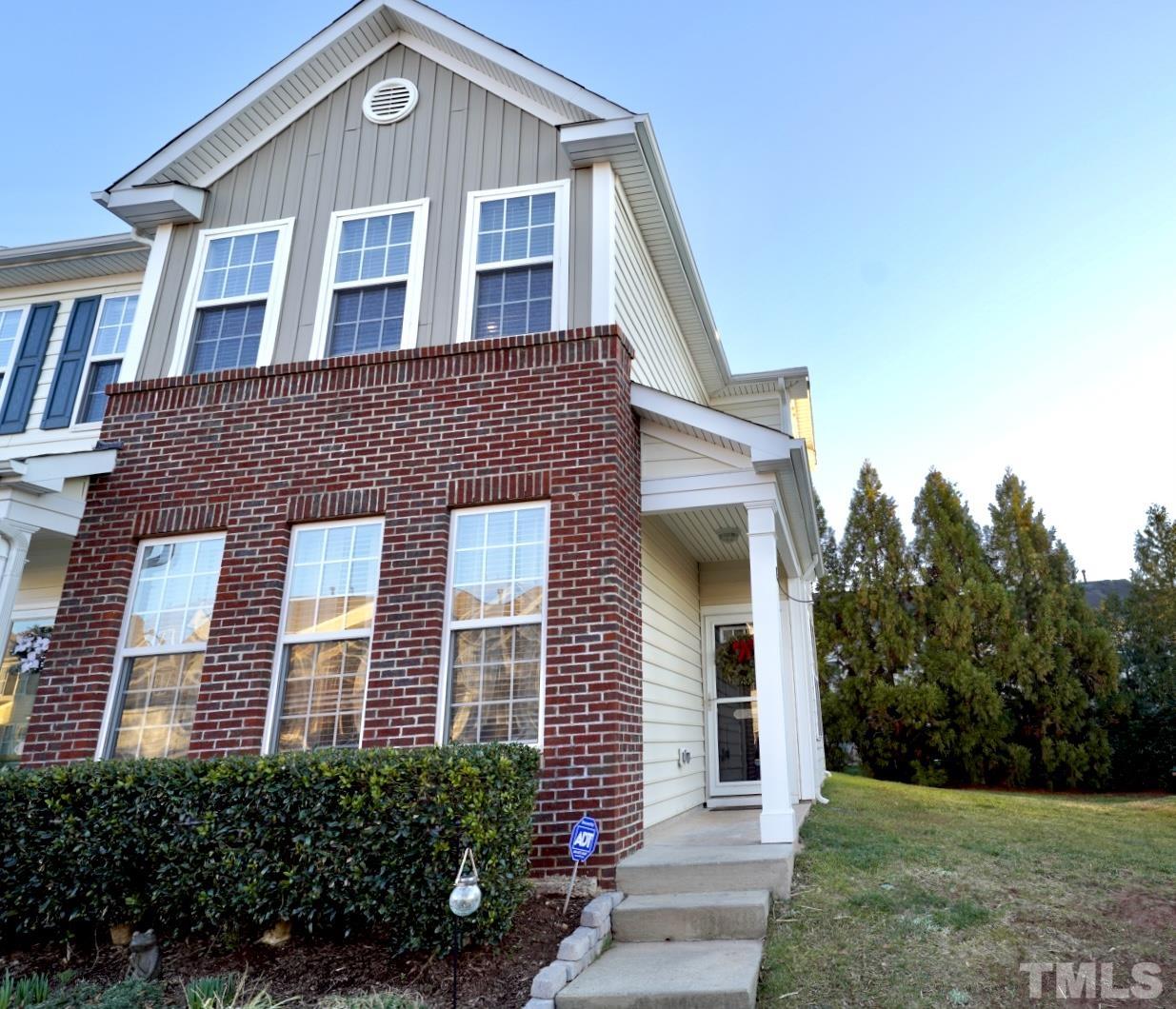 7825 Silverthread Lane Raleigh, NC 27617 - Photo 1 of 8 a front view of a house with yard