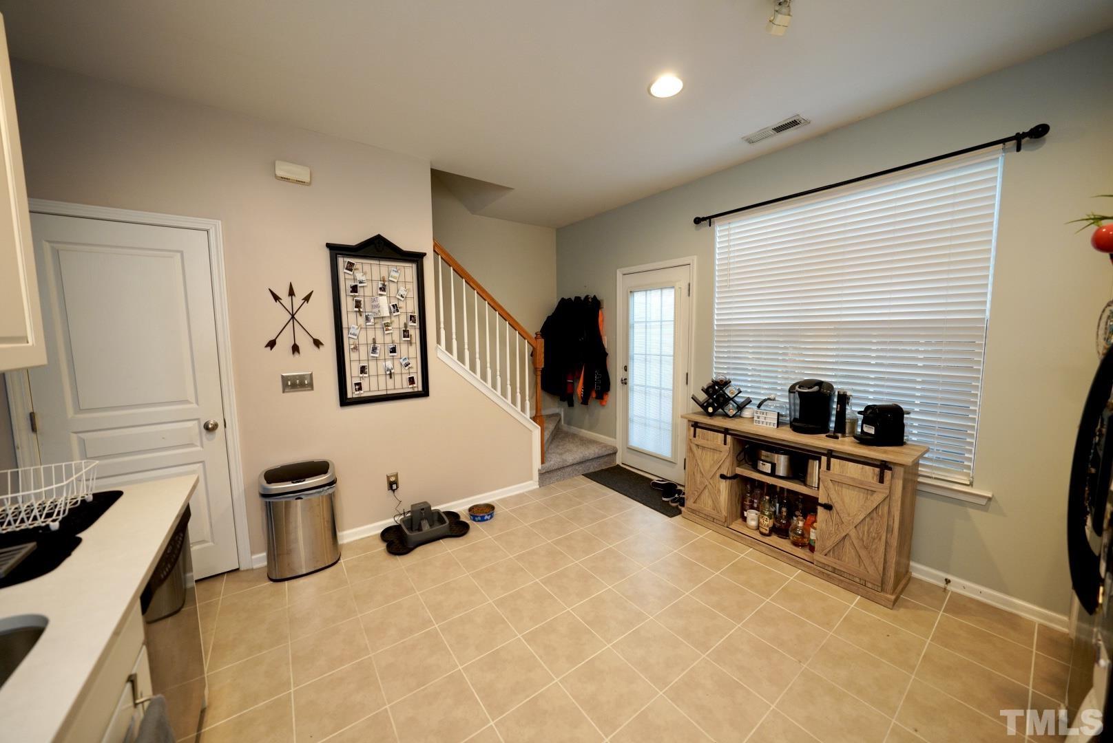 7825 Silverthread Lane Raleigh, NC 27617 - Photo 6 of 8 a view of a workspace with furniture and a window