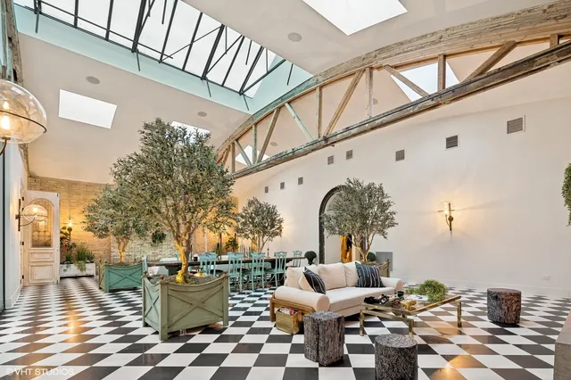 a living room with furniture windows and a fireplace