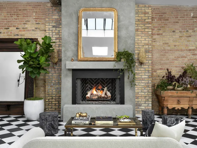 a living room with furniture and a floor to ceiling window